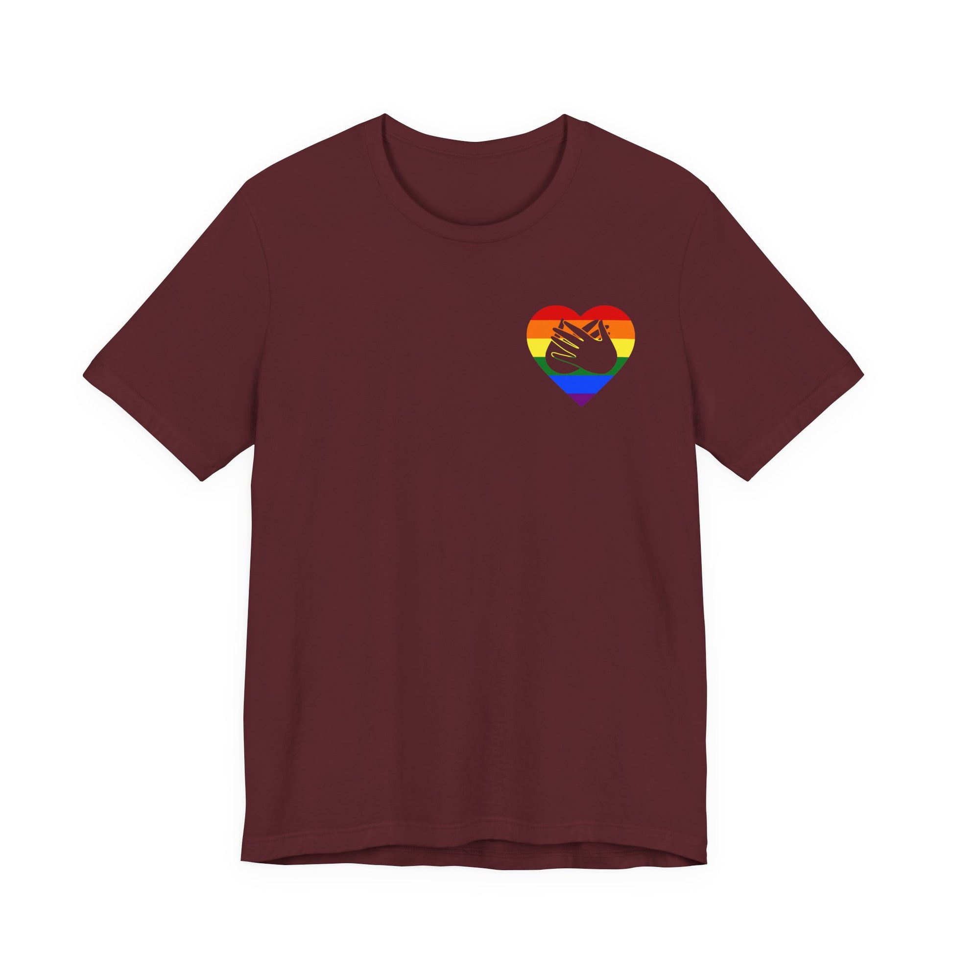 Front view of a maroon T-Shirt showing a pride coloured heart and the iconic BSL Love sign embedded in it on the left side of the chest
