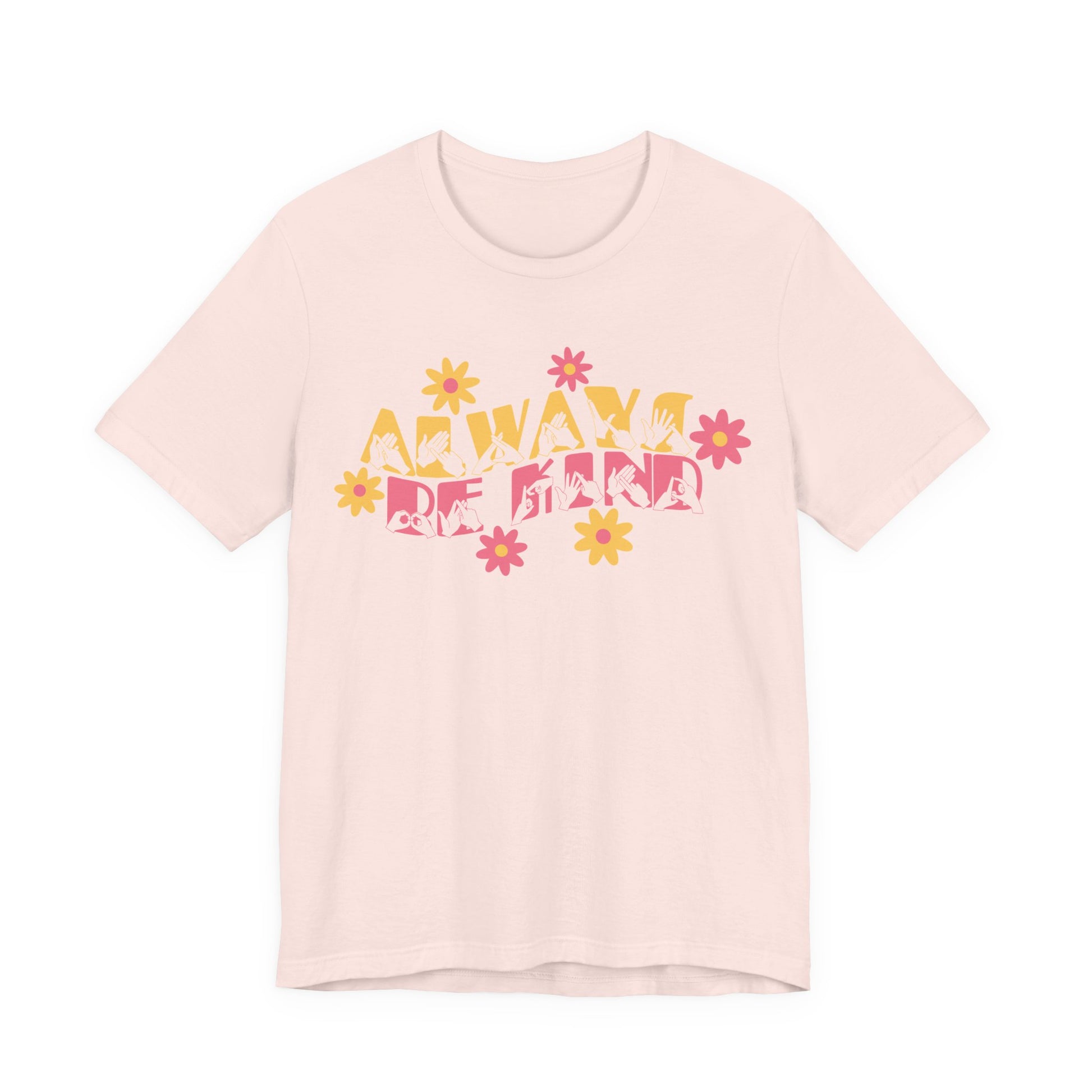 Front view of a soft pink T-Shirt with the phrase Always Be Kind in BSL fingerspelling and text combined with floral design