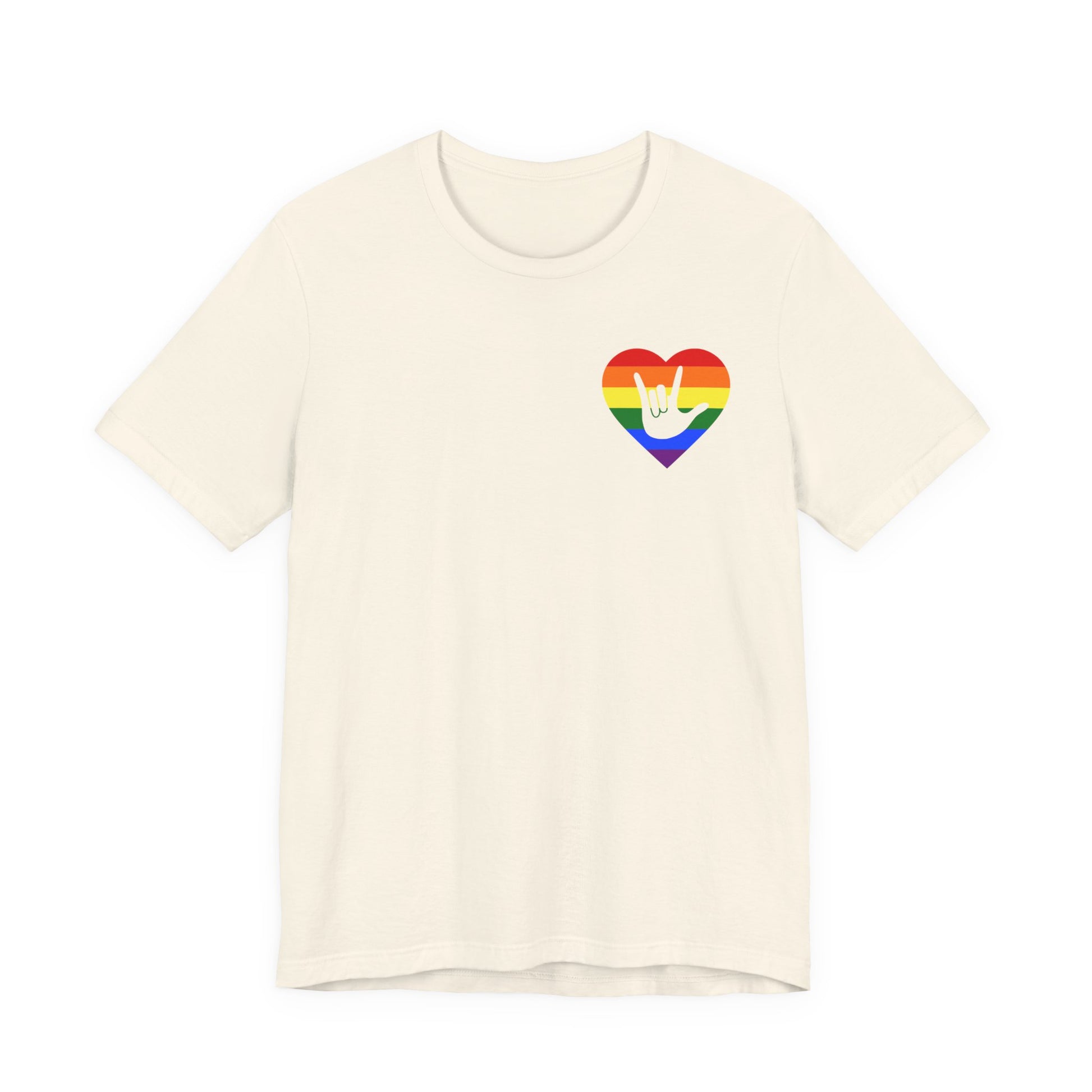 Front view of a natural T-Shirt showing a pride coloured heart and the iconic ASL I Love You sign embedded in it on the left side of the chest