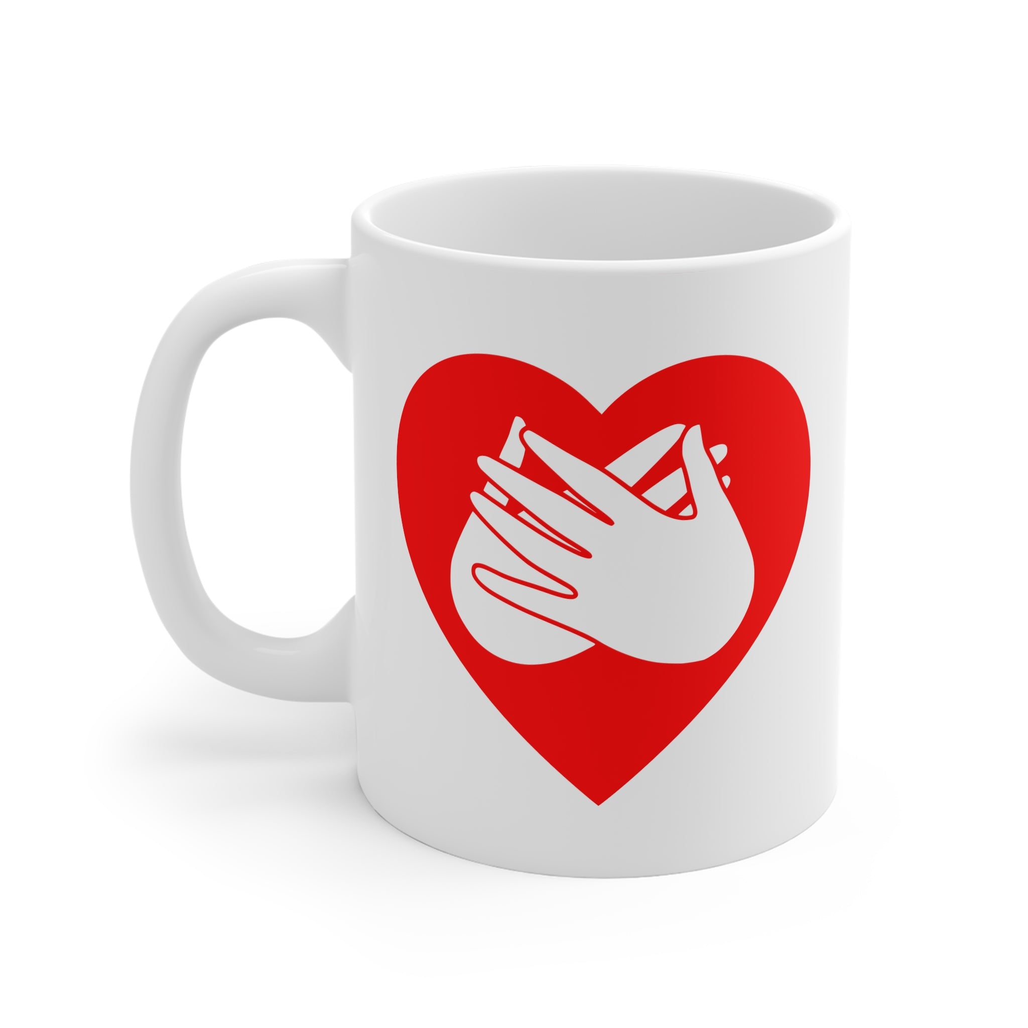 White mug with a red coloured heart design featuring the BSL sign for Love embedded in it. The mug handle is on the left hand side of the mug.