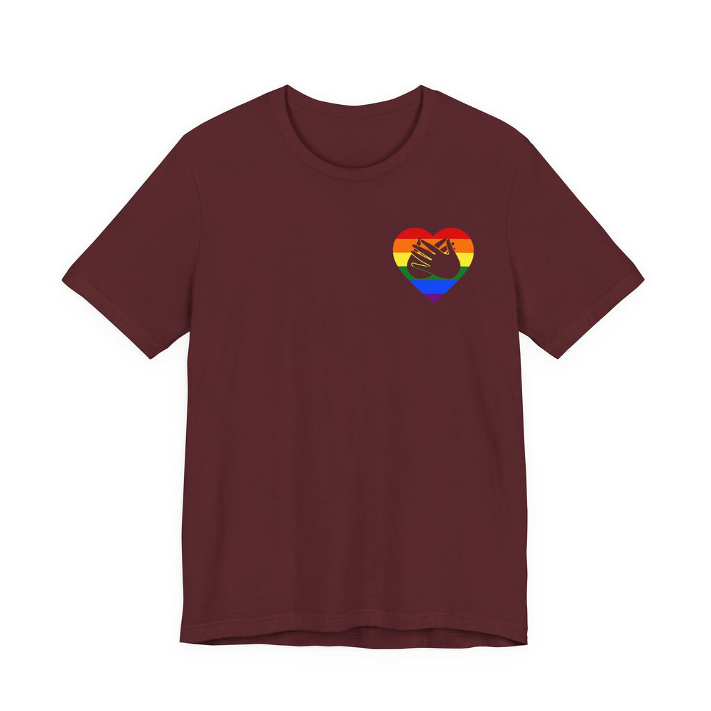 Front view of a maroon T-Shirt showing a pride coloured heart and the iconic BSL Love sign embedded in it on the left side of the chest
