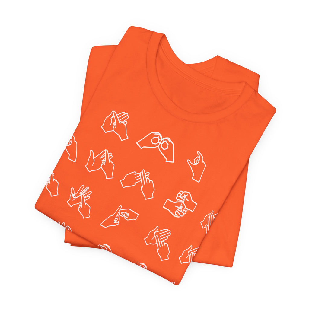 Folded orange t-shirt with BSL Alphabet - White Fingerspelling