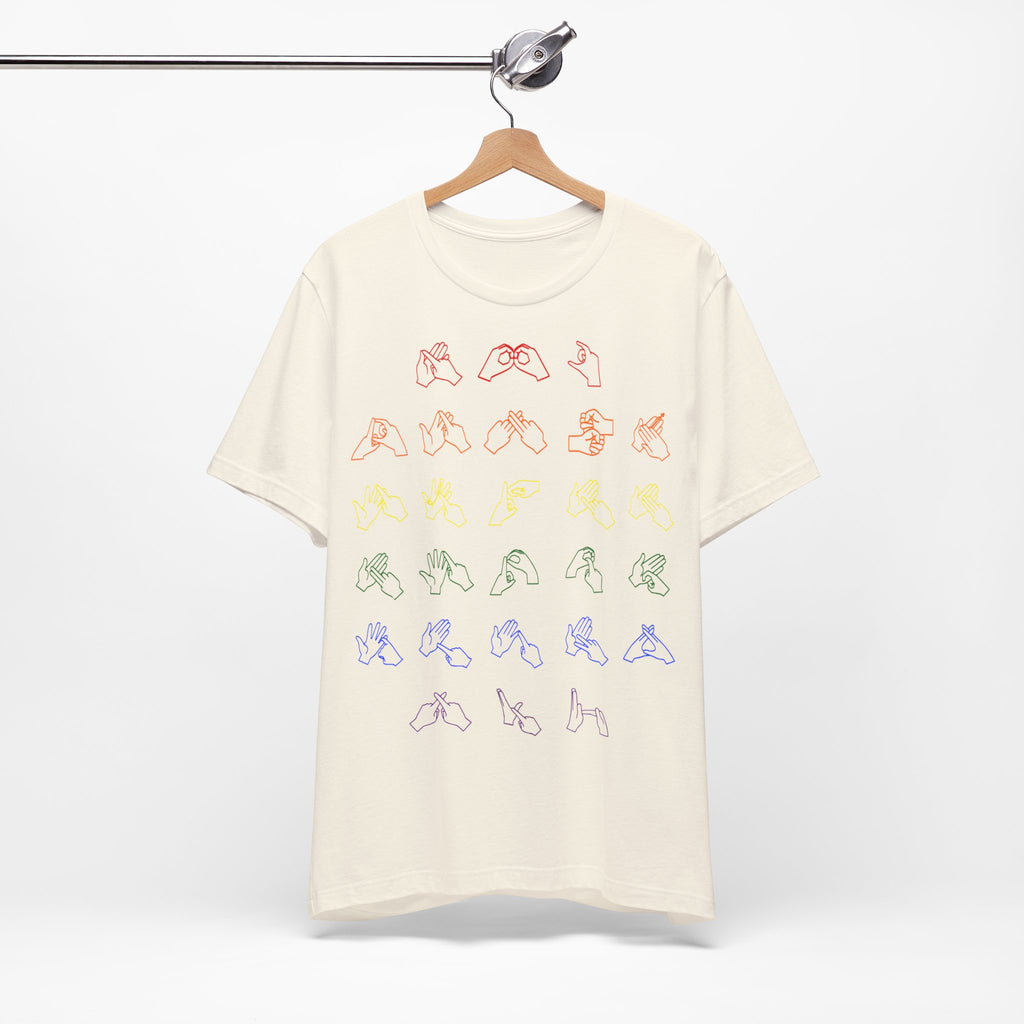 Front view of a natural t-shirt with BSL Alphabet - Pride Fingerspelling, on a hanger against a white background