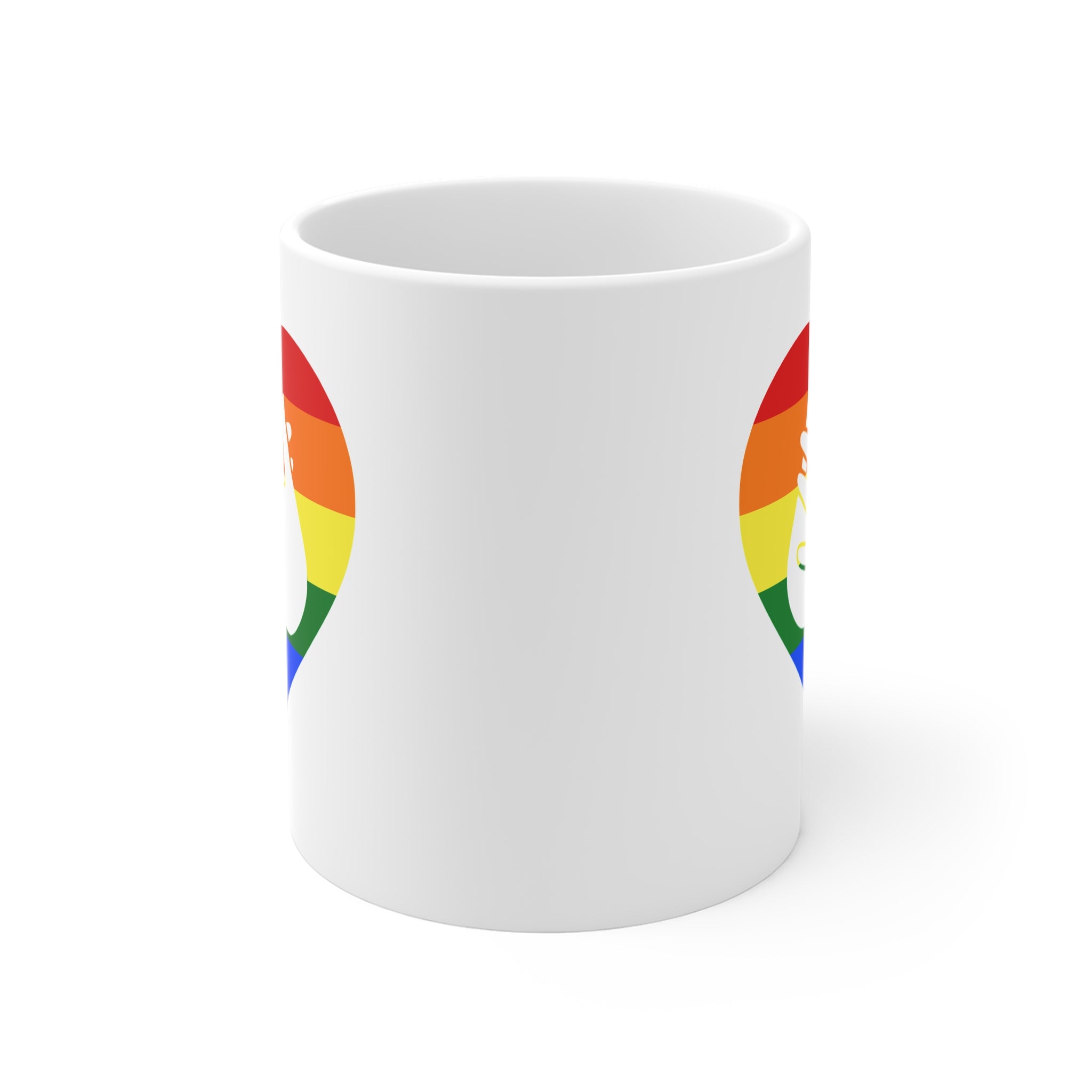 White mug with no handle visible, showing part of the pride coloured heart design on each side.