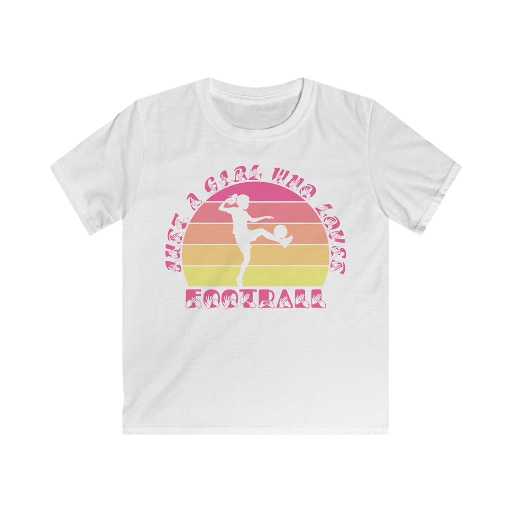 White t-shirt with the phrase "Just a Girl Who Loves Football" in BSL Fingerspelling and text featuring a colourful retro sunset and a silhouette of a boy kicking a football.