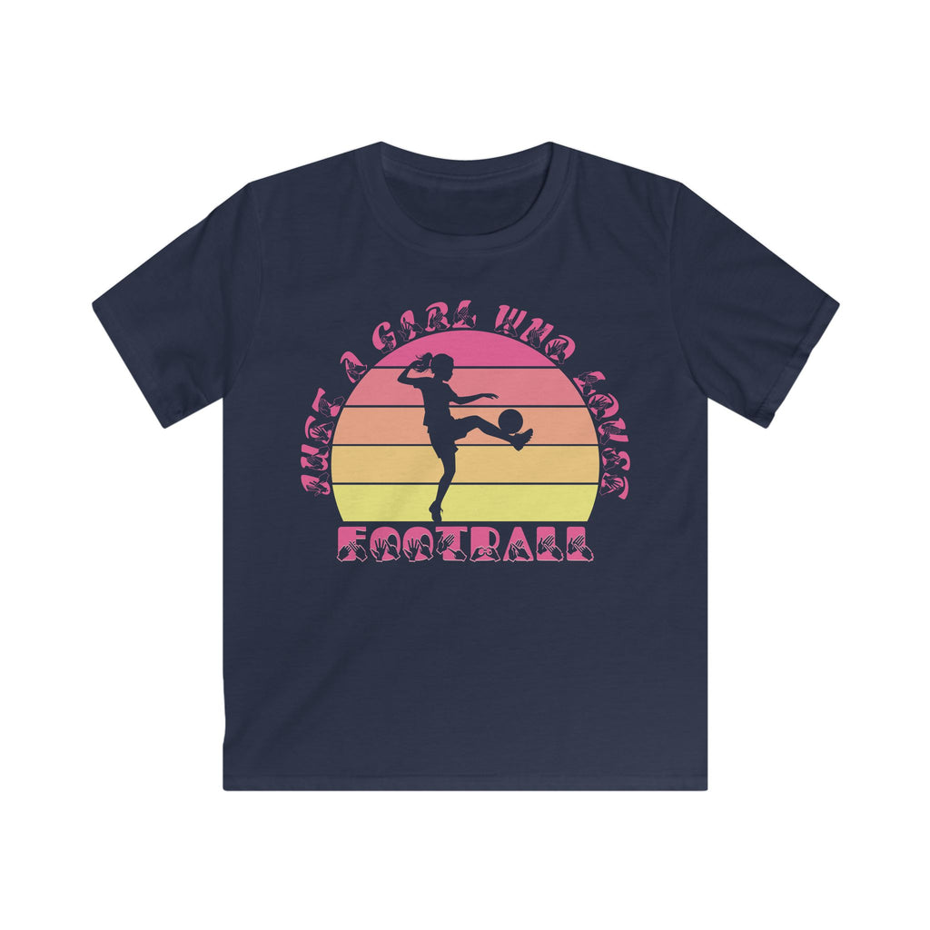 Navy t-shirt with the phrase "Just a Girl Who Loves Football" in BSL Fingerspelling and text featuring a colourful retro sunset and a silhouette of a boy kicking a football.