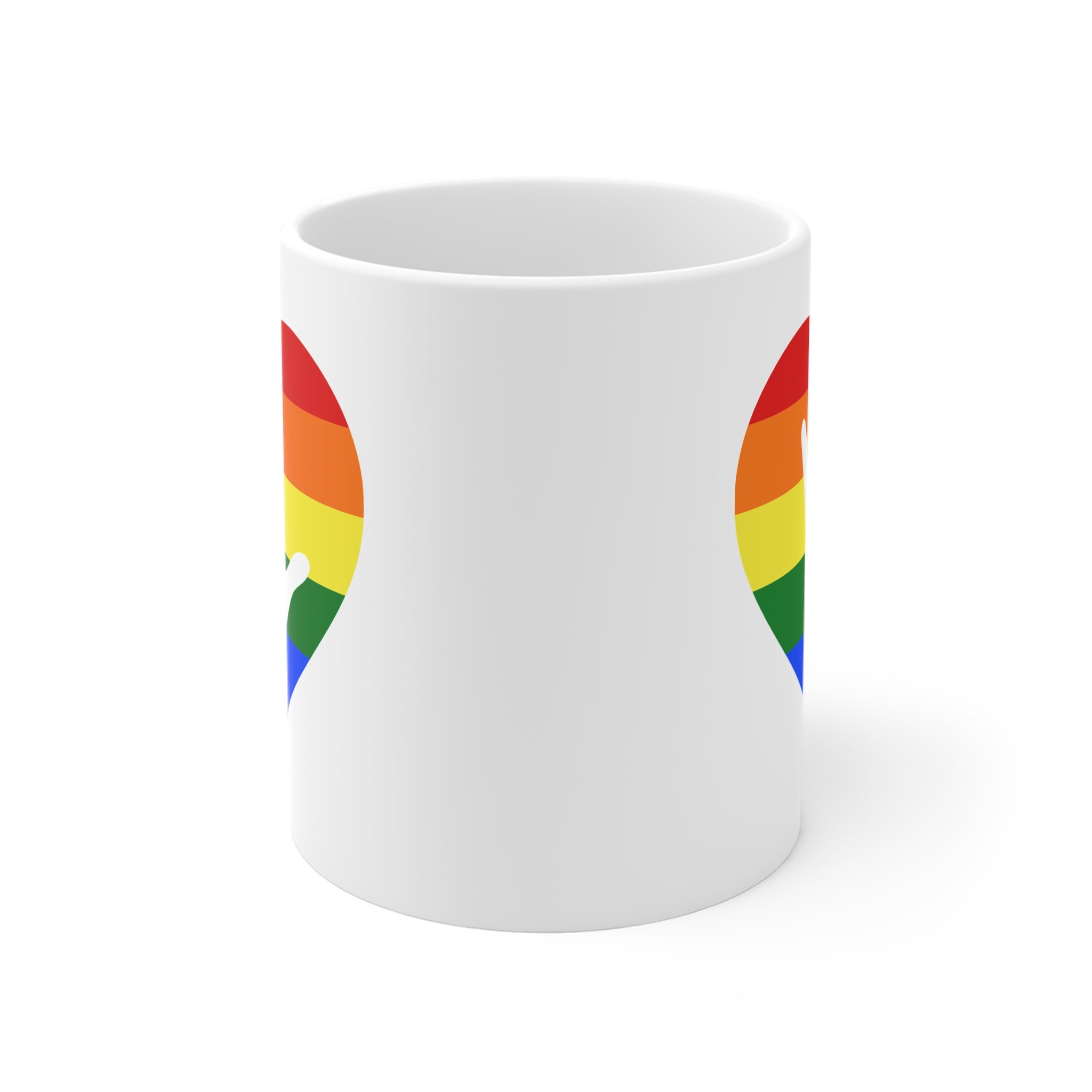 White mug with no handle visible, showing part of the pride coloured heart design on each side.