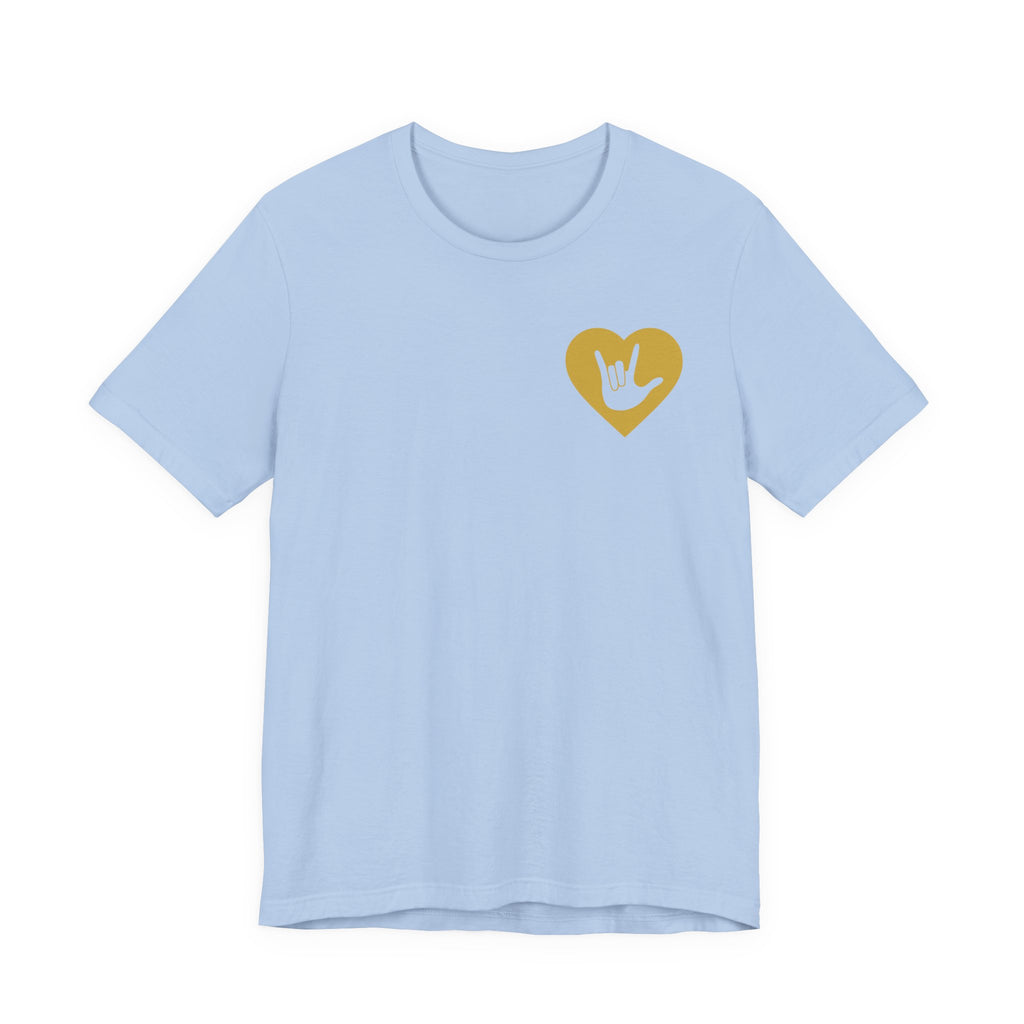 Front view of a baby blue T-Shirt showing a gold coloured heart and the iconic ASL I Love You sign embedded in it on the left side of the chest