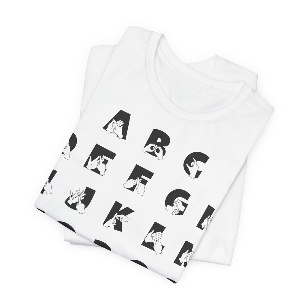 Folded white t-shirt with BSL Alphabet - Black Fingerspelling & Text