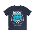 Navy t-shirt with the phrase "Birthday Boy" above a gaming controller, the word "Level" below it, a customisable age underneath, and stars surrounding the design.