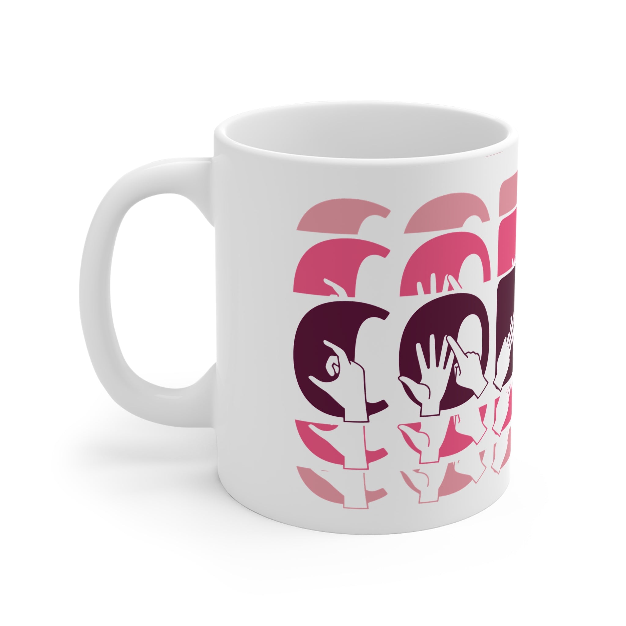 White mug featuring the phrase Coffee written in BSL Fingerspelling and Text wrapping around the mug in pink cutaway design. The mug handle is on the left hand side of the mug.
