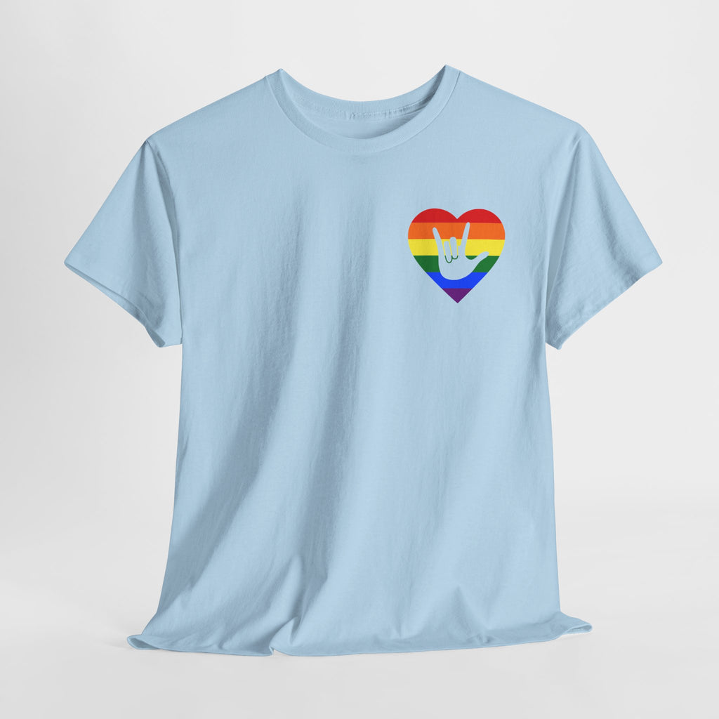 Front view of a light blue T-Shirt showing a pride coloured heart and the iconic ASL I Love You sign embedded in it on the left side of the chest with a light grey background
