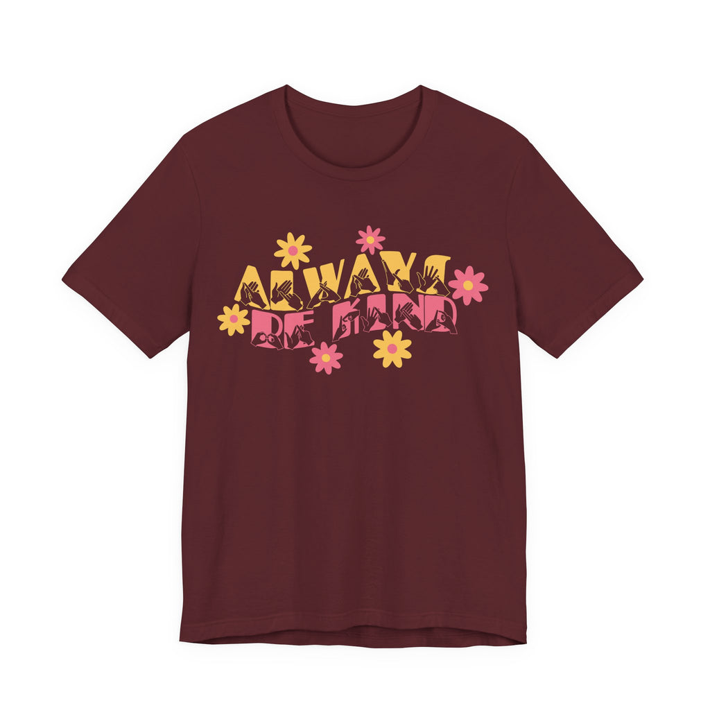 Front view of a maroon T-Shirt with the phrase Always Be Kind in BSL fingerspelling and text combined with floral design