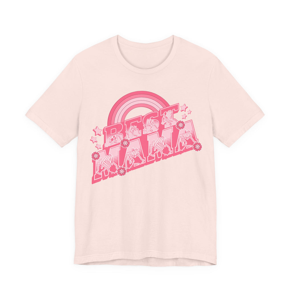 Soft pink T-shirt with ‘Best Mama’ shown in BSL fingerspelling and text, with rainbow, stars, and floral accents