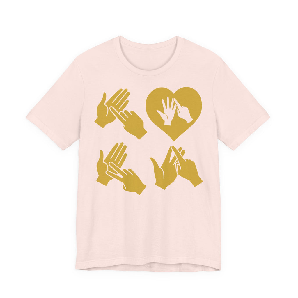 Front view of a soft pink T-Shirt with the word Love in gold BSL Fingerspelling with the 'O' embedded in a heart shape
