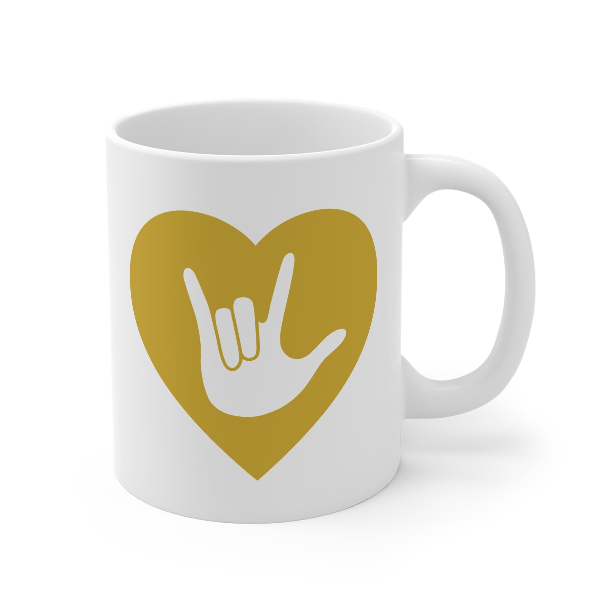 White mug with a gold coloured heart design featuring the ASL sign for I Love You embedded in it. The mug handle is on the right hand side of the mug.