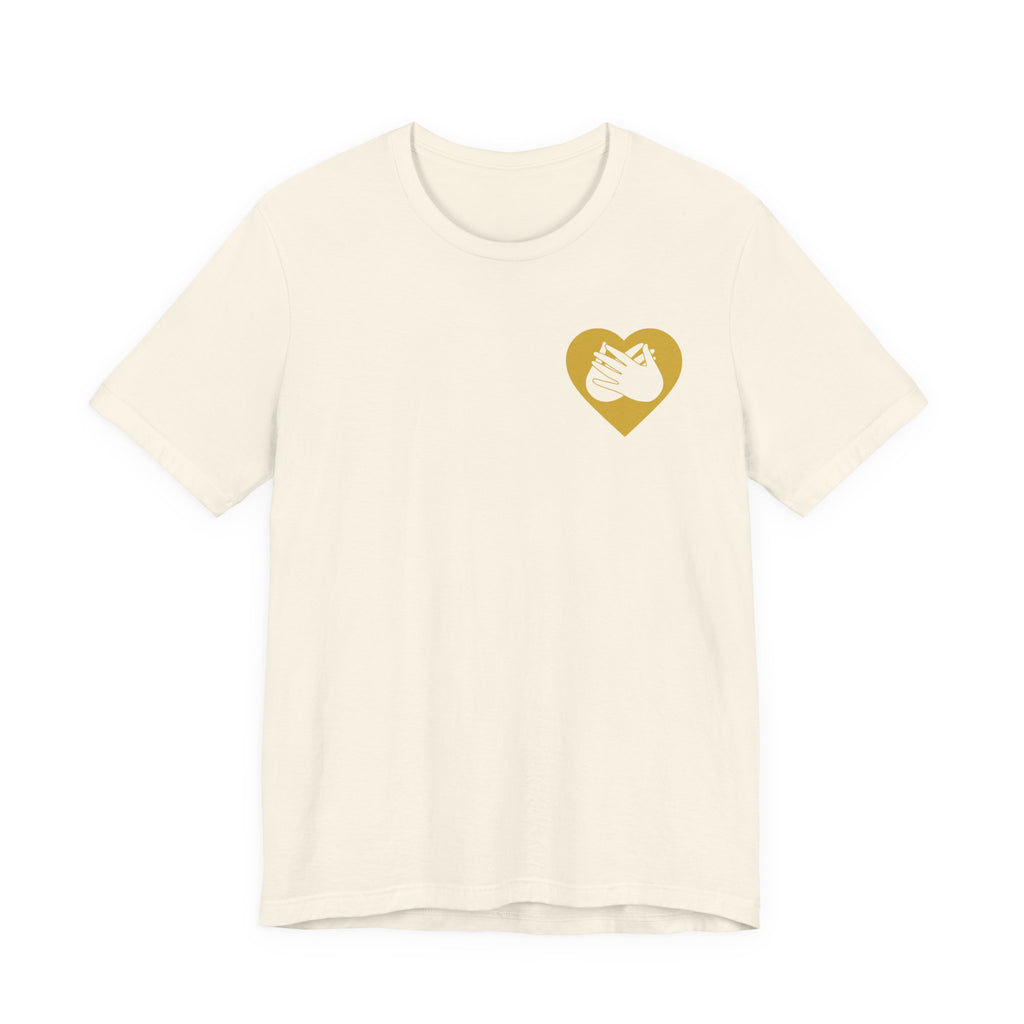Front view of a natural T-Shirt showing a gold coloured heart and the iconic BSL Love sign embedded in it on the left side of the chest