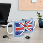 Two mugs with BSL Fingerspelling and text Union Flag design on a desk with office items.