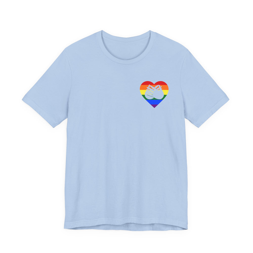 Front view of a baby blue T-Shirt showing a pride coloured heart and the iconic BSL Love sign embedded in it on the left side of the chest