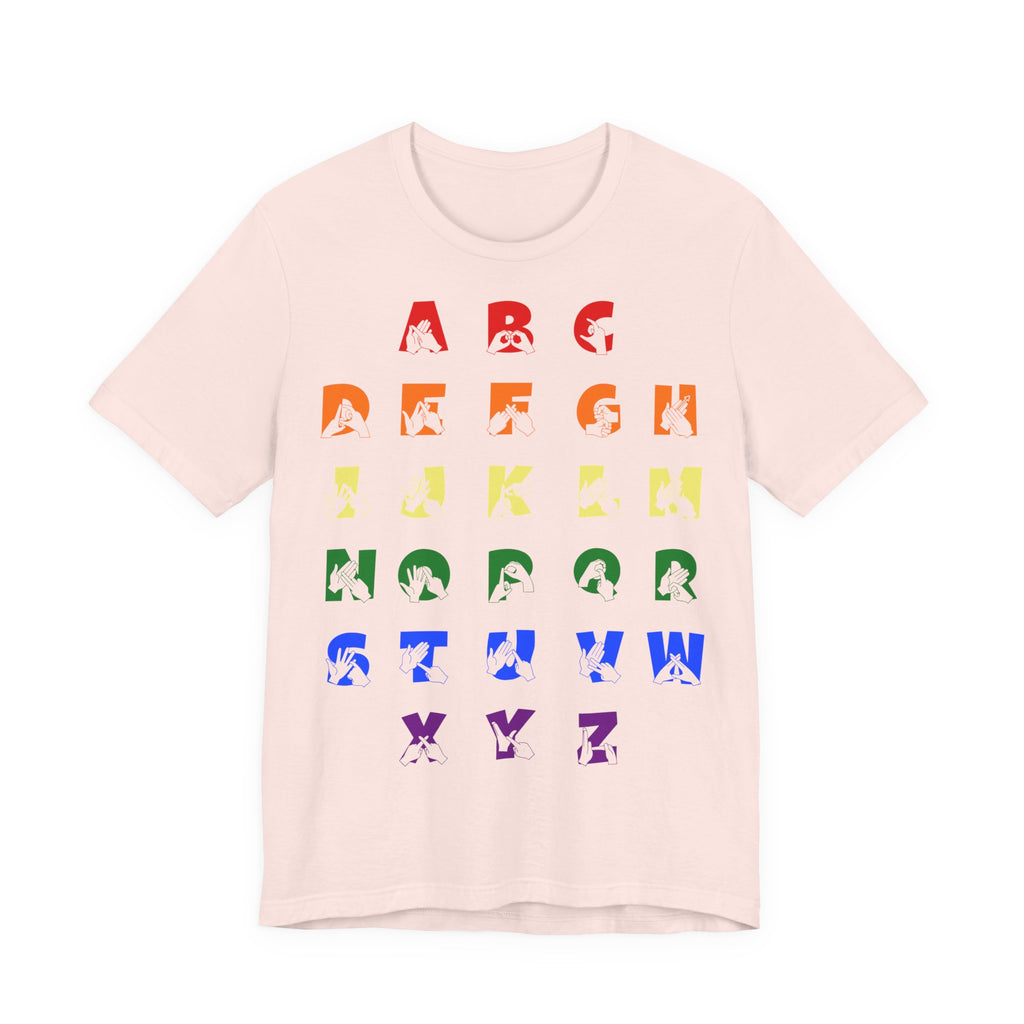 Front view of a soft pink t-shirt with BSL Alphabet - Pride Fingerspelling & Text