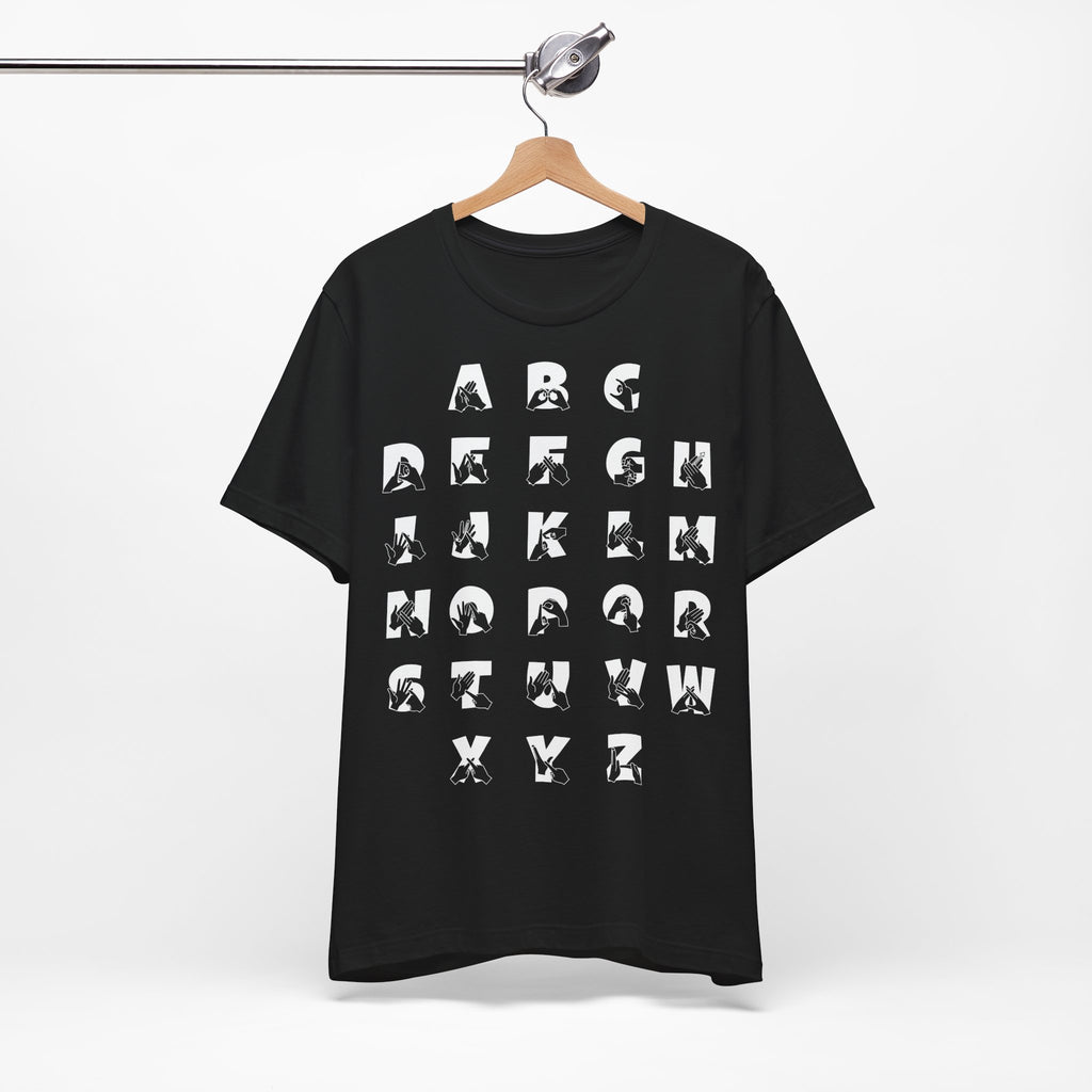 Front view of a black t-shirt with BSL Alphabet - White Fingerspelling & Text, on a hanger against a white background