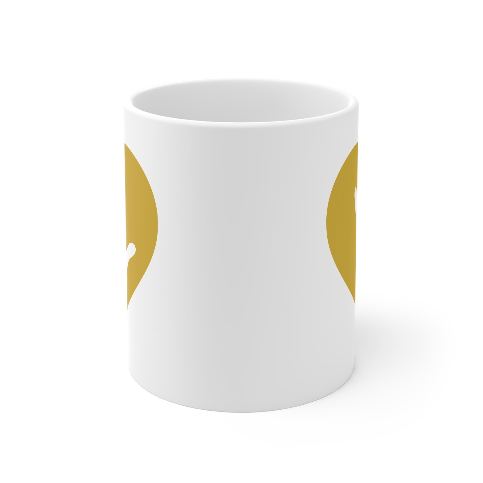 White mug with no handle visible, showing part of the gold coloured heart design on each side.