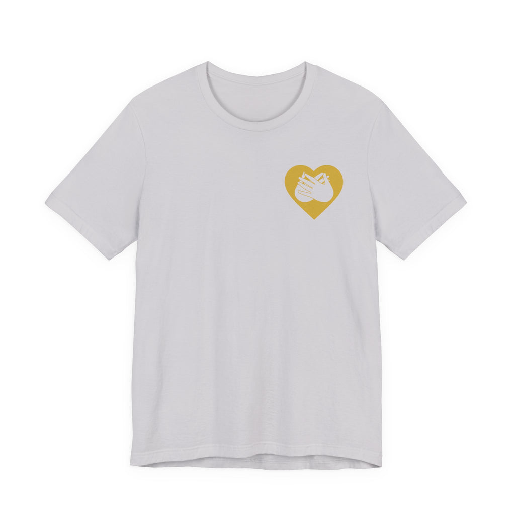 Front view of a lavender dust T-Shirt showing a gold coloured heart and the iconic BSL Love sign embedded in it on the left side of the chest