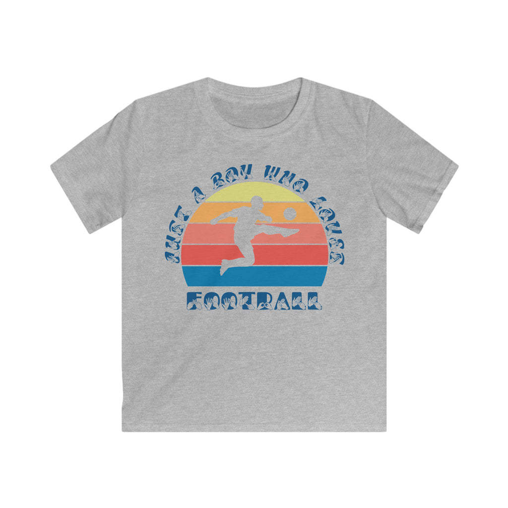 Sport grey t-shirt with the phrase "Just a Boy Who Loves Football" in BSL Fingerspelling and text featuring a colourful retro sunset and a silhouette of a boy kicking a football.