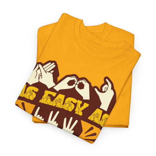Folded Gold t-shirt with the phrase ABC As Easy As 123 in Fingerspelling & Text