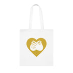 White Tote Bag showing a gold coloured heart and the iconic BSL Love sign embedded in it