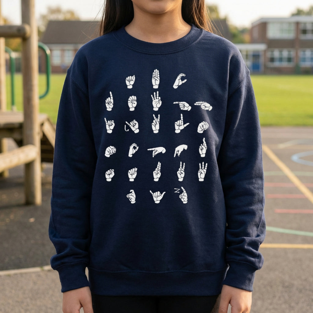 Person wearing a navy blue sweatshirt with white hand signs on a playground background