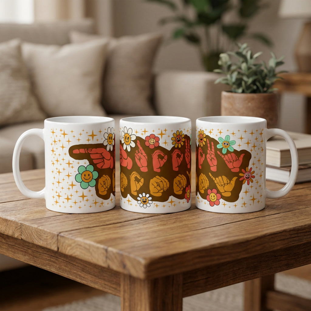 Three mugs with colorful designs on a wooden table in a cozy living room setting.