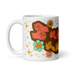 White mug showing a Groovy Mammy BSL design with the handle on the left.