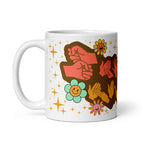 White mug showing a Groovy Mummy BSL design with the handle on the left.