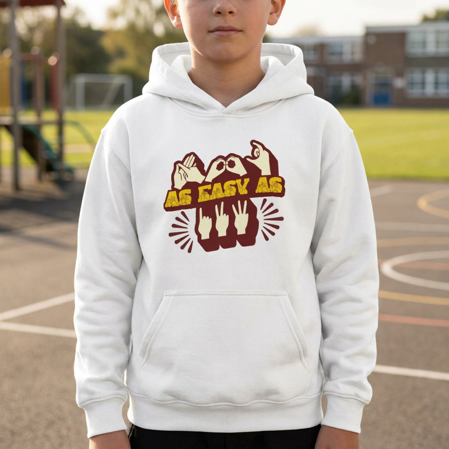 A person wearing a white hoodie with ‘ABC As Easy As 123’ in BSL fingerspelling and text characters