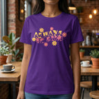 A person wearing purple T-Shirt with the phrase Always Be Kind in BSL fingerspelling and text combined with floral design