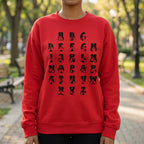 Person wearing a red sweatshirt with black alphabet design in an outdoor setting
