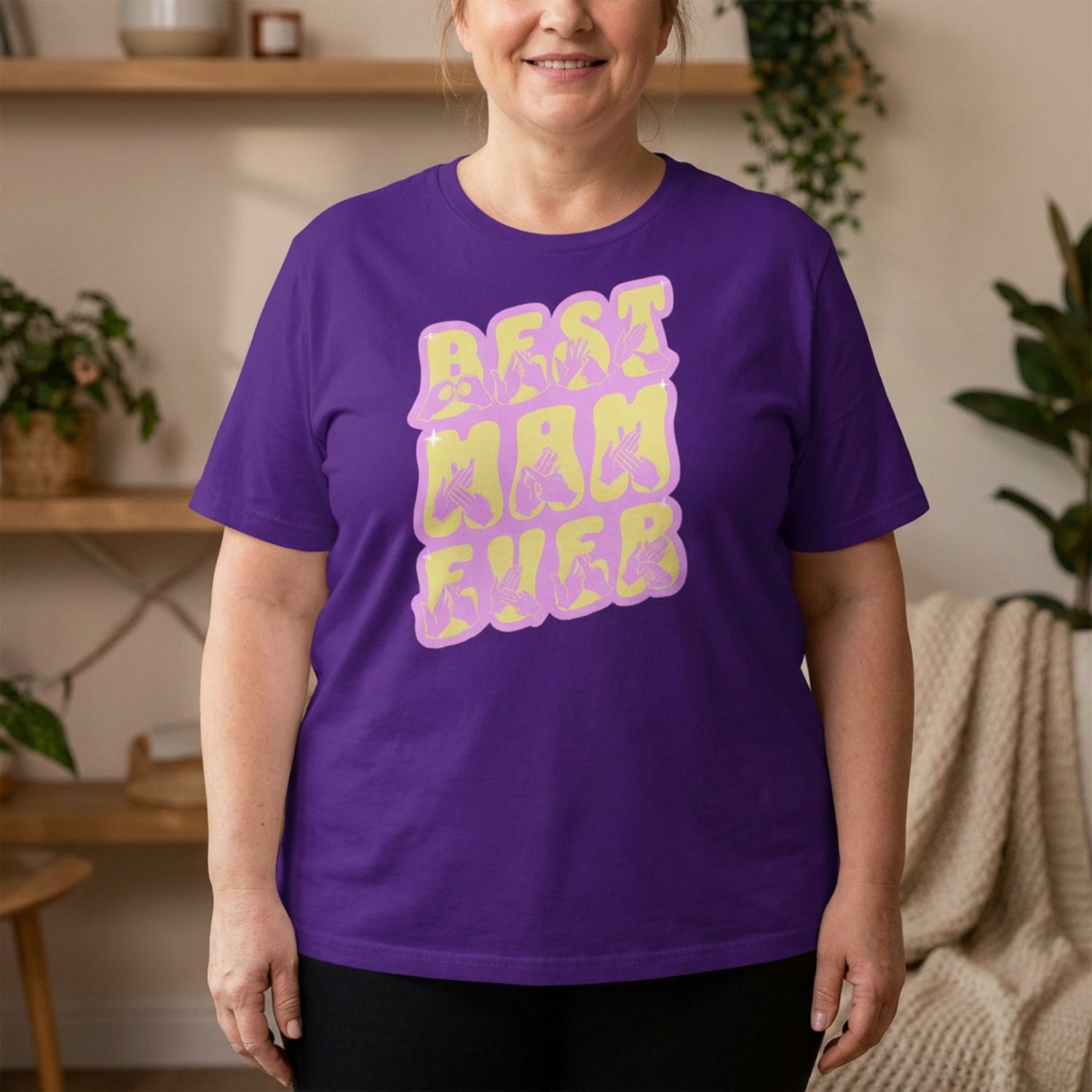 Person wearing a purple t-shirt with 'BEST MAM EVER' in purple and yellow.