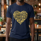 Person wearing a navy blue t-shirt with a gold heart design in a casual setting