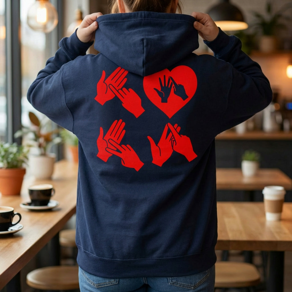 Back view of a person wearing a hoodie with red fingerspelling design.
