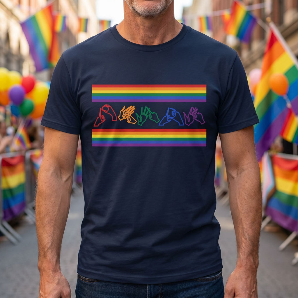 Man wearing a navy blue t-shirt with pride rainbow-colored fingerspelling at a Pride event.