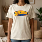 Person wearing a natural t-shirt with 'Supermum' graphic in a home setting