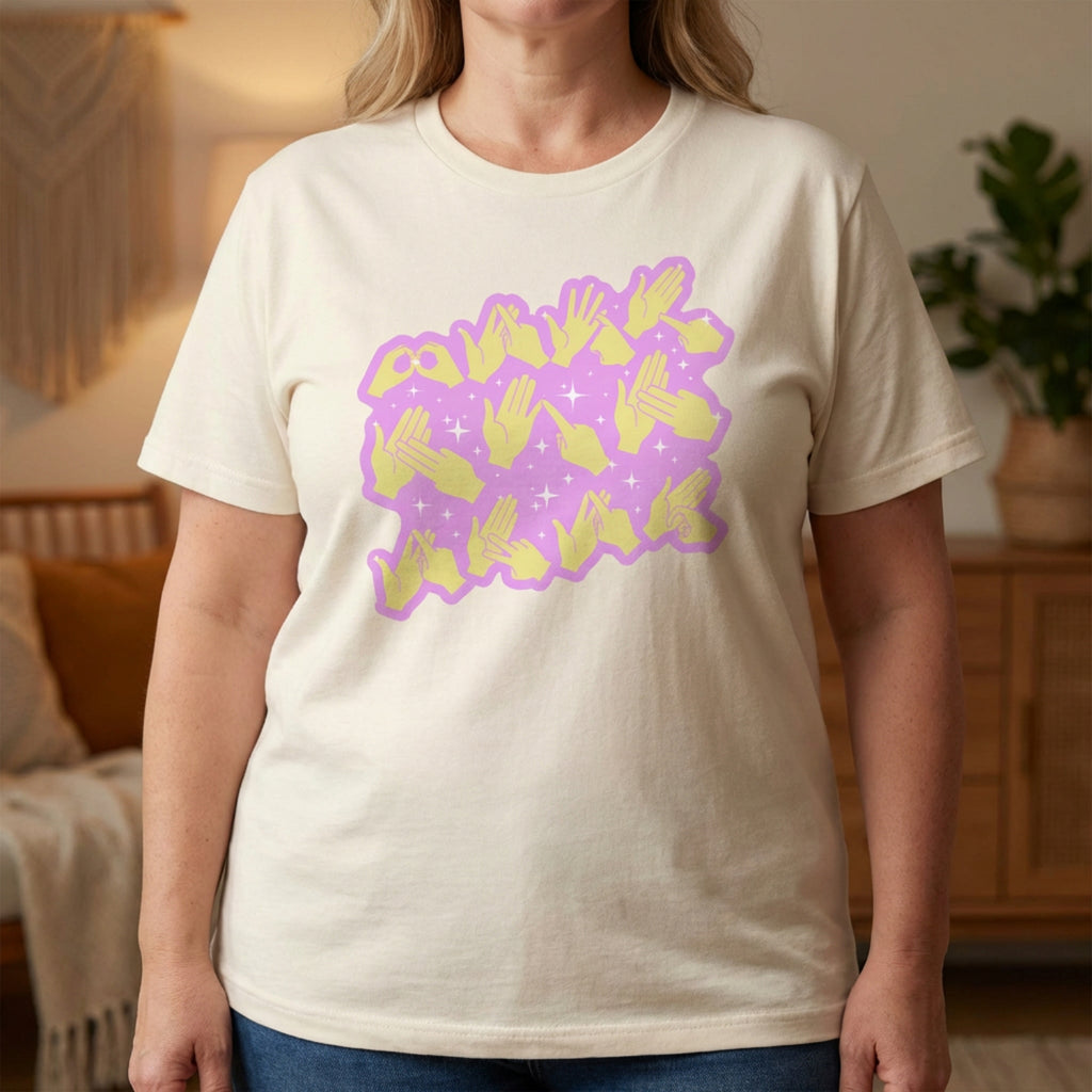 Person wearing a natural t-shirt with a purple and yellow graphic design in a room.
