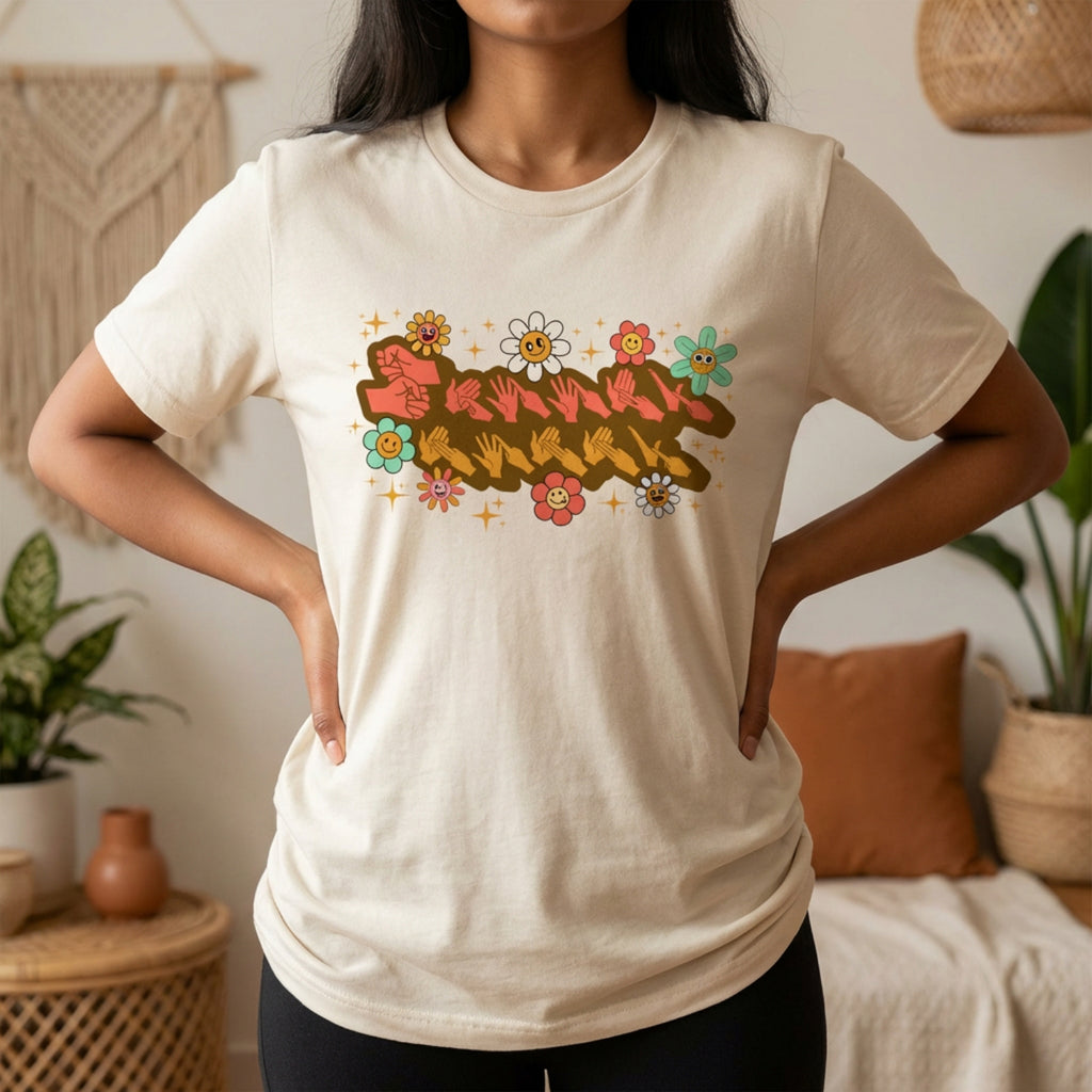 Person wearing a natural t-shirt with a colorful graphic design in a casual setting.