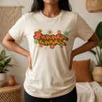 Person wearing a natural t-shirt with a colorful graphic design in a casual setting.