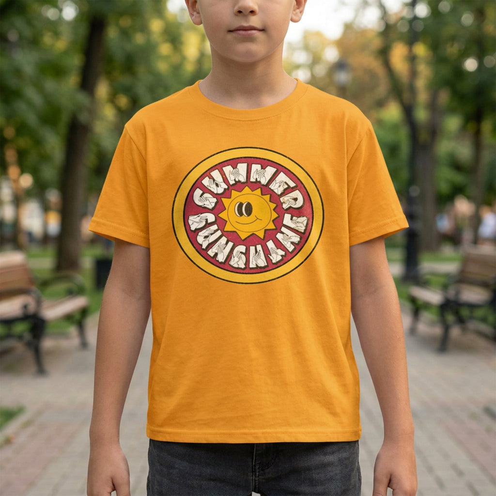 Child wearing a yellow t-shirt with a summer camp graphic in an outdoor setting