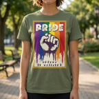 Person wearing a green t-shirt with a rainbow-themed design featuring a raised fist and the word 'PRIDE' in ASL fingerspelling.