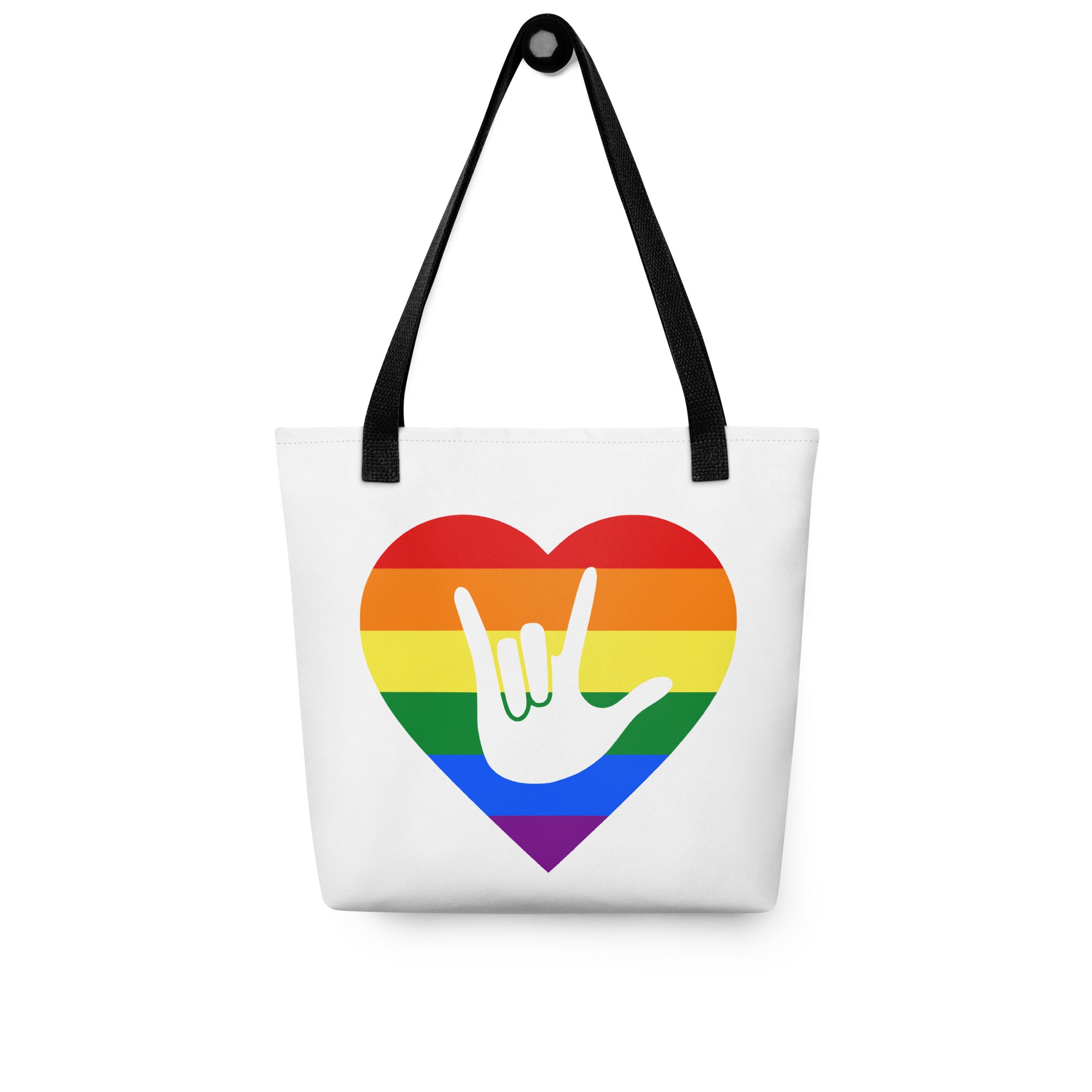 Tote bag with a black handle and a pride heart with the ASL I love you sign at its center.