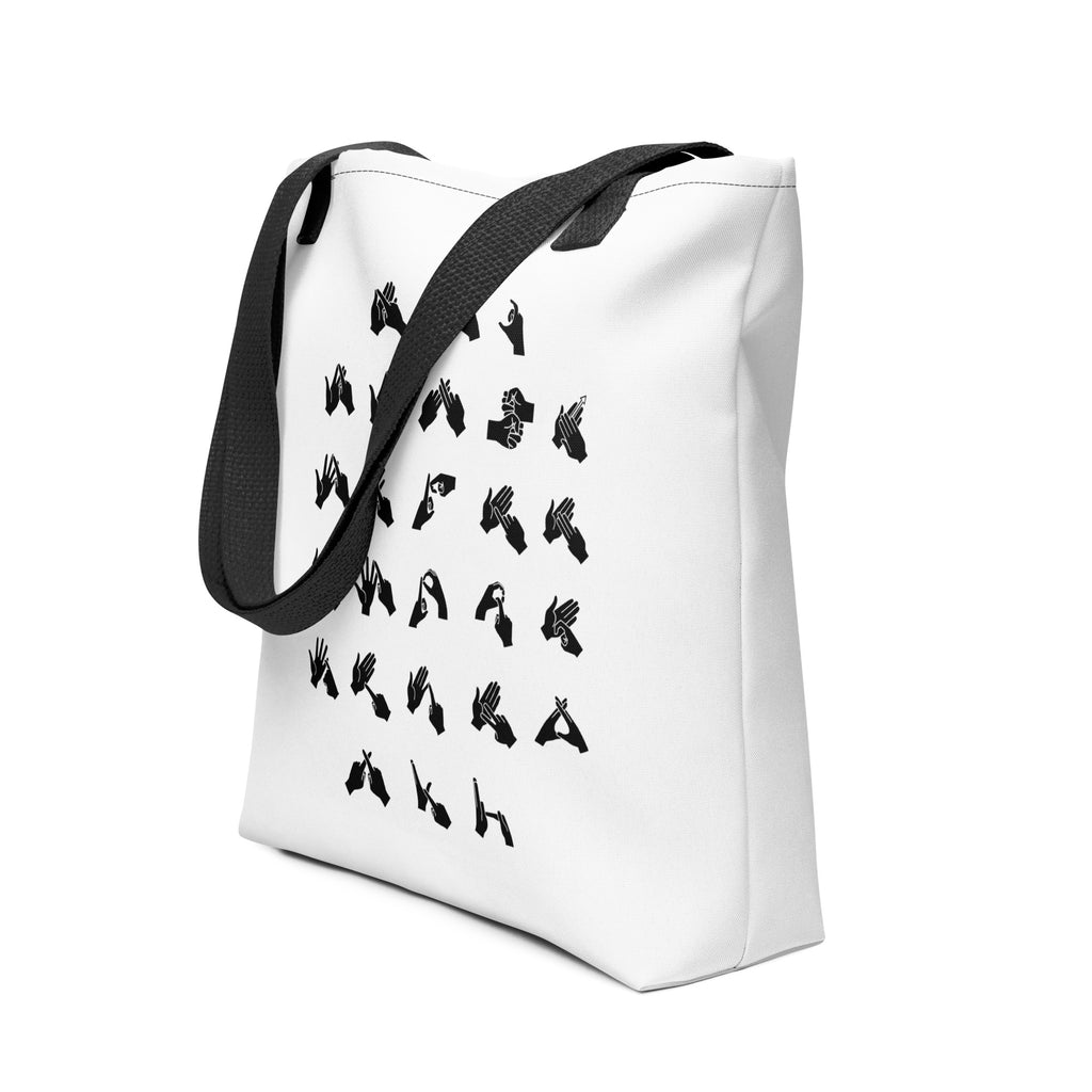 An angled view of a white Tote Bag with a black handle showing BSL Alphabet - Black Fingerspelling