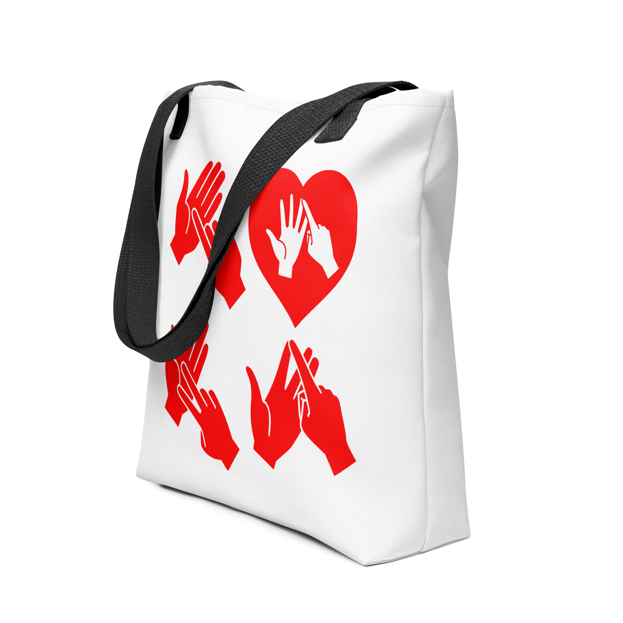 An angled view of a white Tote Bag with black handle showing the word Love in red BSL Fingerspelling with the 'O' embedded in a heart shape